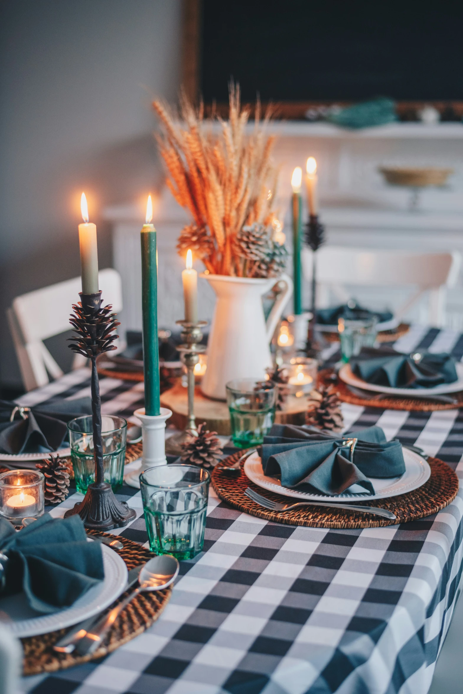 black and white tablecloth decorated with a green centerpiece