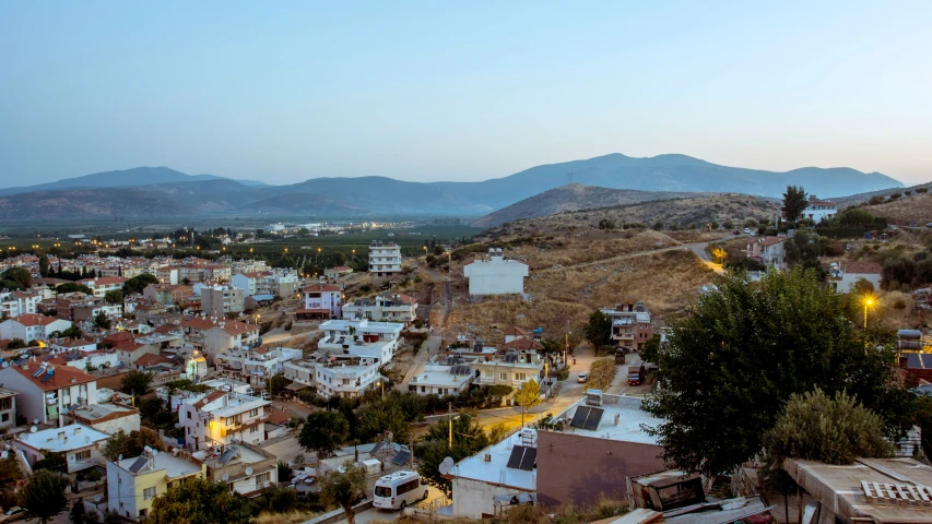 an old town with mountains in the background