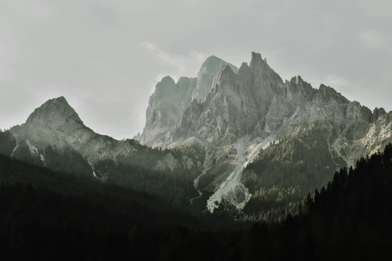 some mountains in the distance with some snow