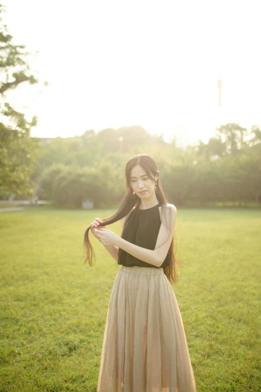 woman in the park holding a very long hair