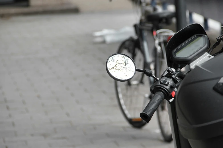 a street with many parked bikes on it