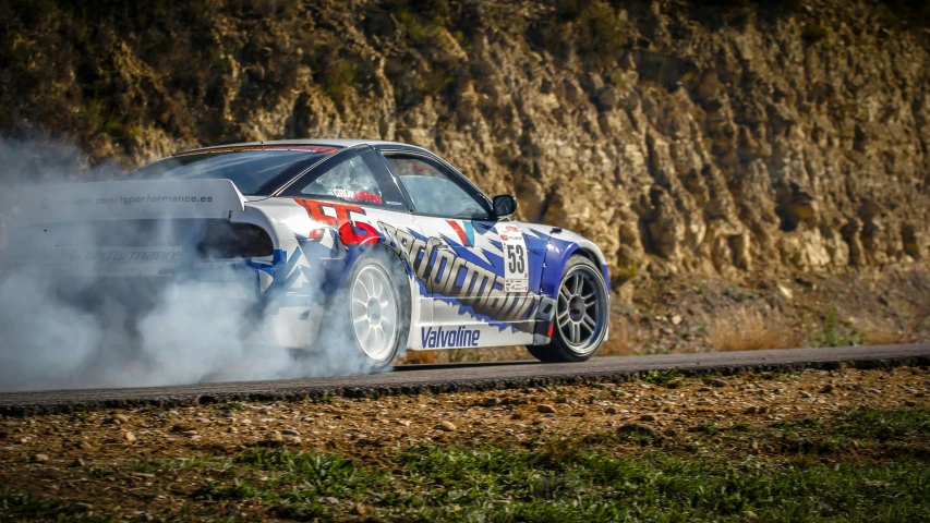 a car with wheels is smoking in the road