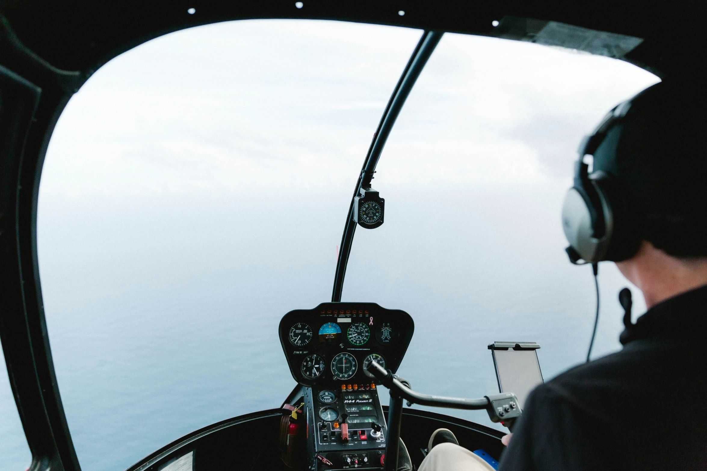 an air pilot is in the cockpit of a helicopter