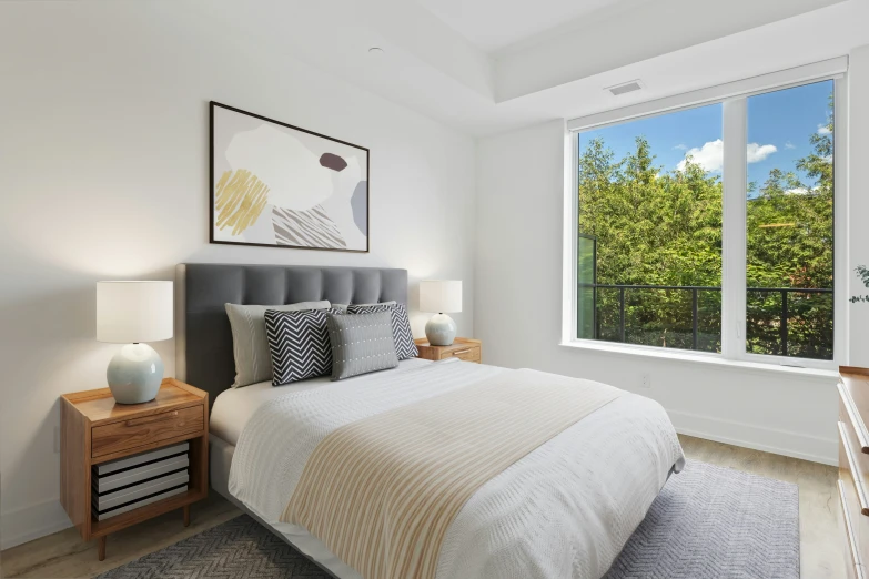 a bed sitting next to a window in a bedroom