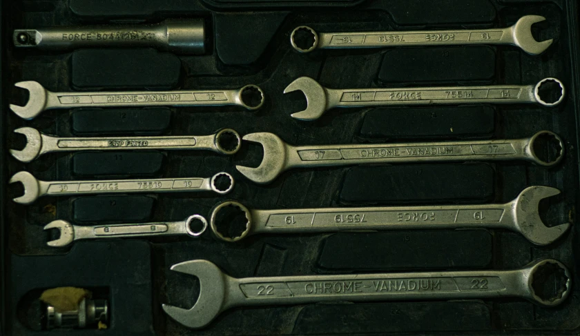 six spanners are attached to the black case