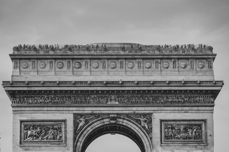 black and white image of a large building with many ornate columns