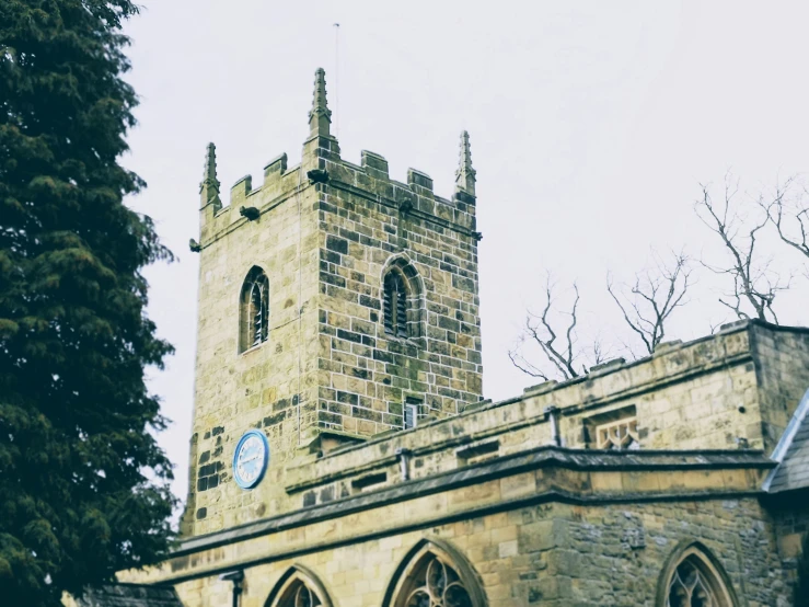 a large tower sitting behind a large brick building