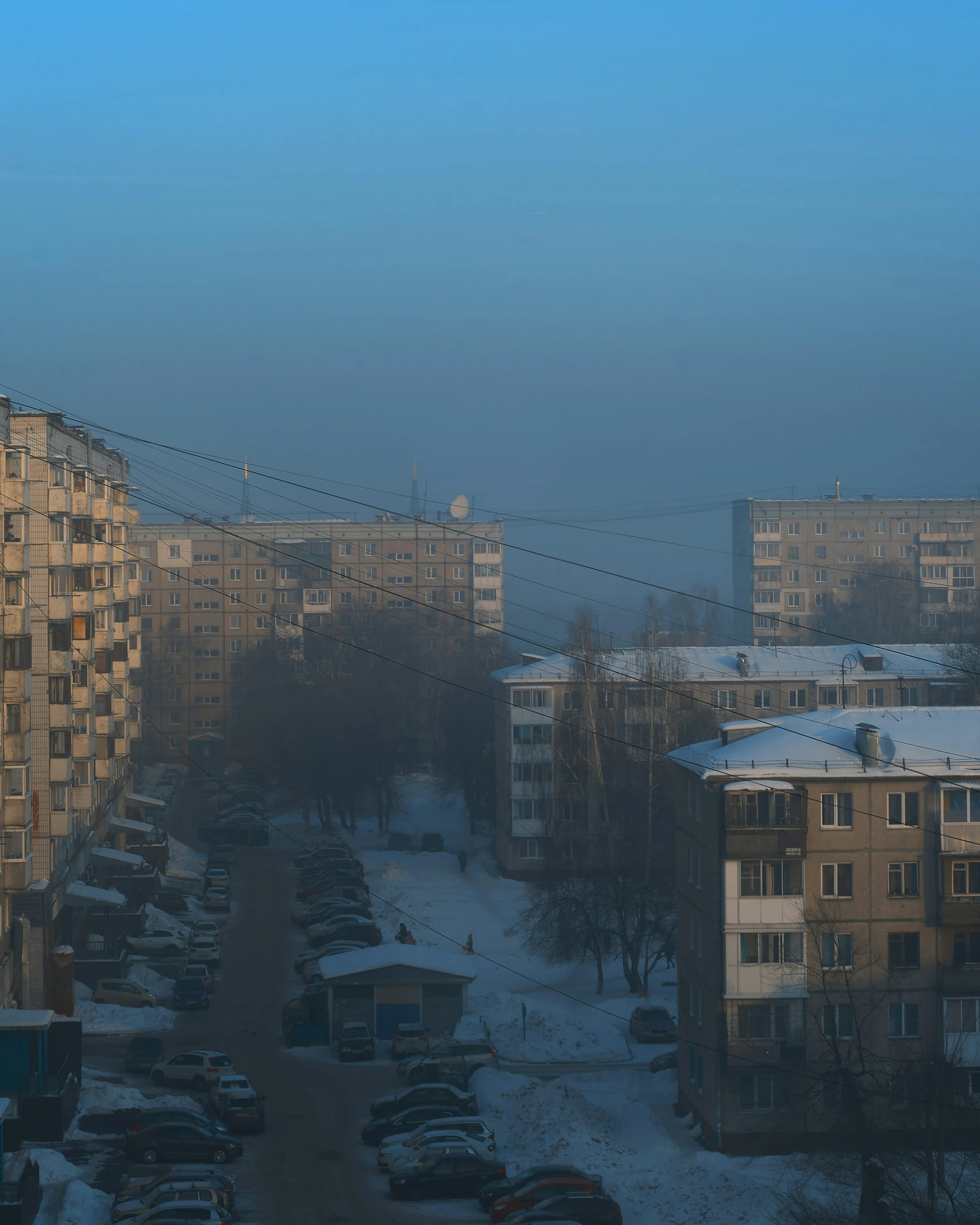 view of a lot of buildings in a snow - covered area