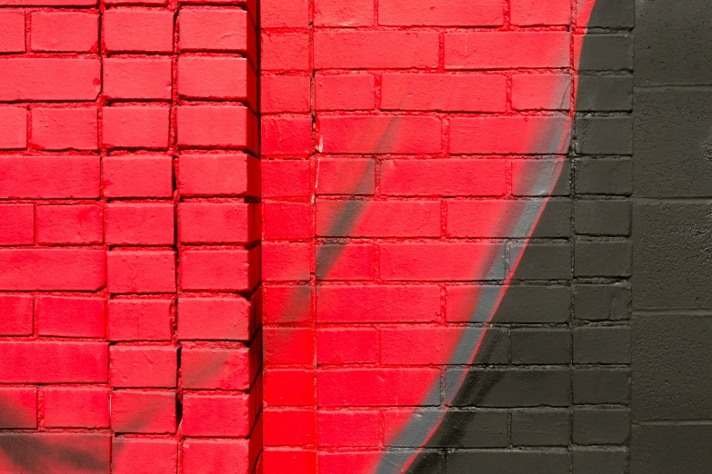 a painted red sign on the side of a building