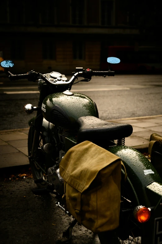 a motor bike parked along a street at night