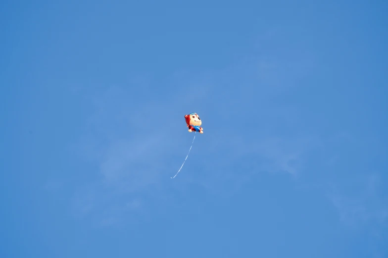 the kite has two tails and is blue