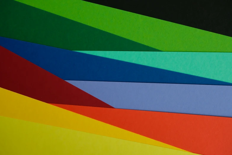colorful papers laid out on top of each other