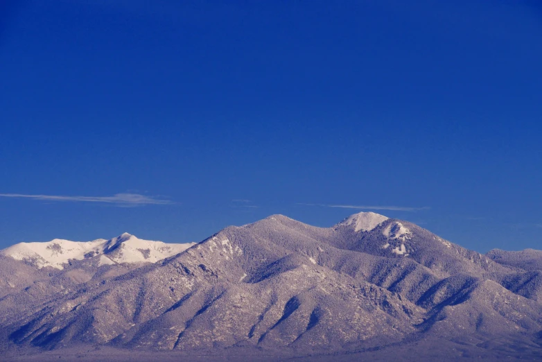 a mountain range, with snow on it