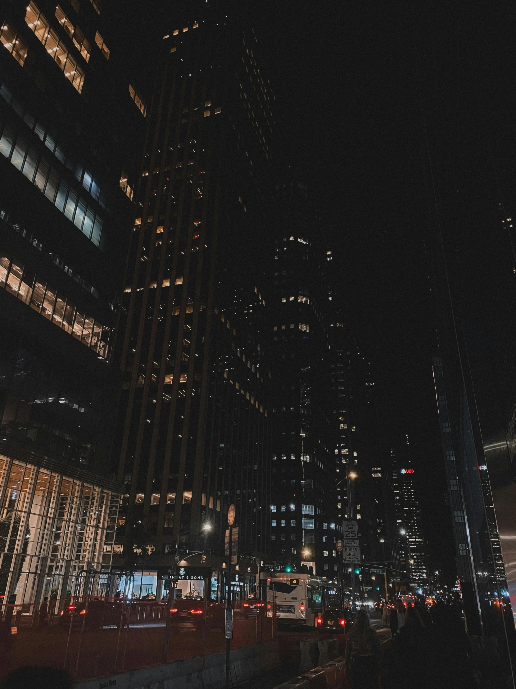 night scene looking over an urban area with several tall buildings