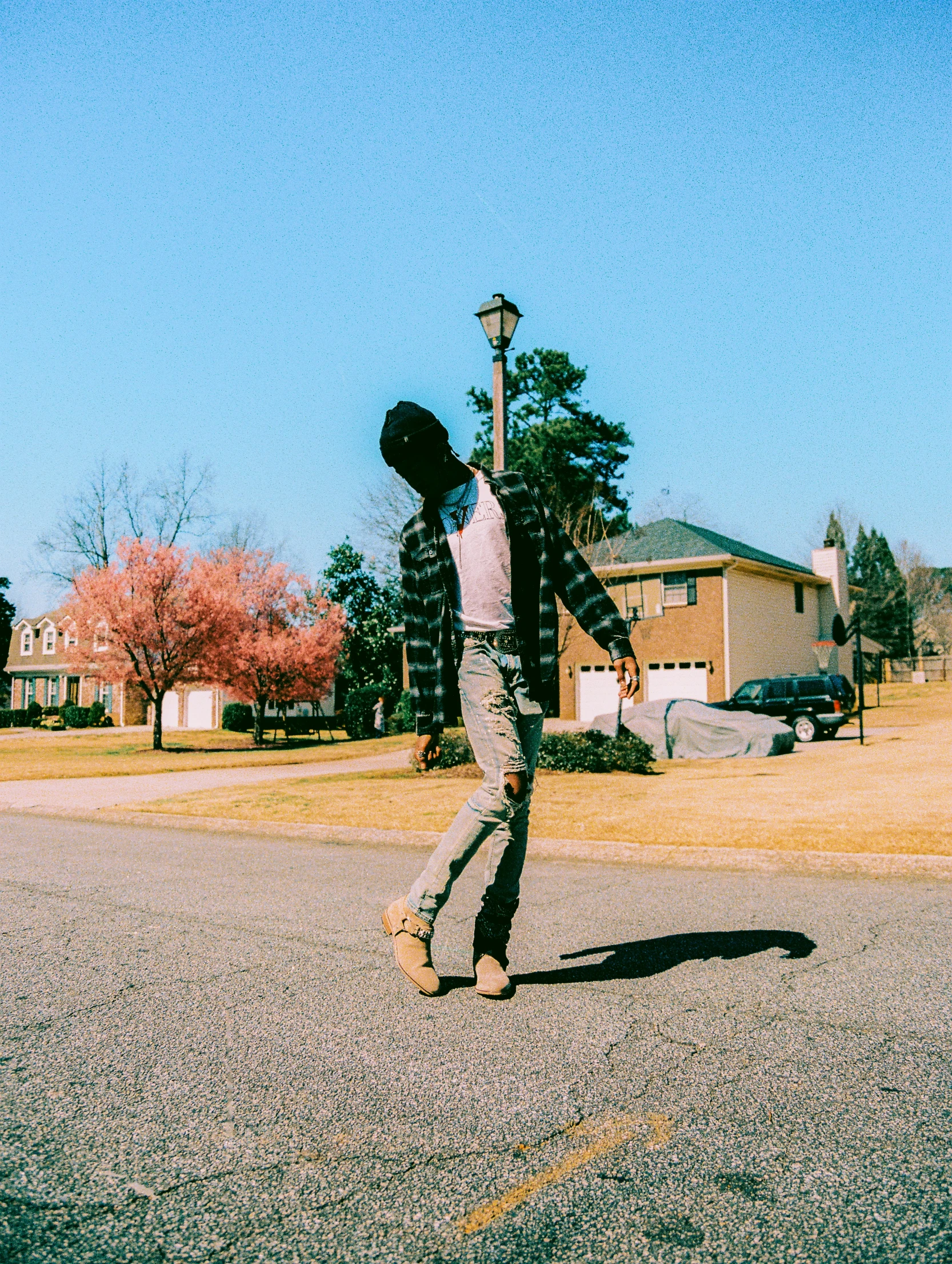 a man on a skateboard in the middle of a street