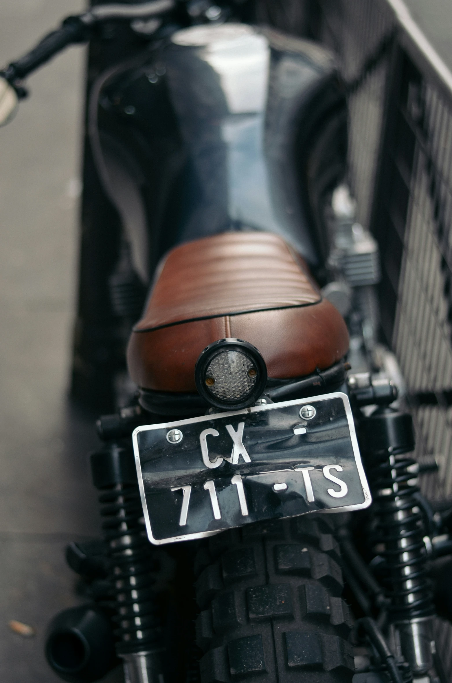 the motorcycle has an antique style license plate