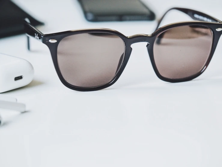 a pair of glasses is seen sitting on a desk