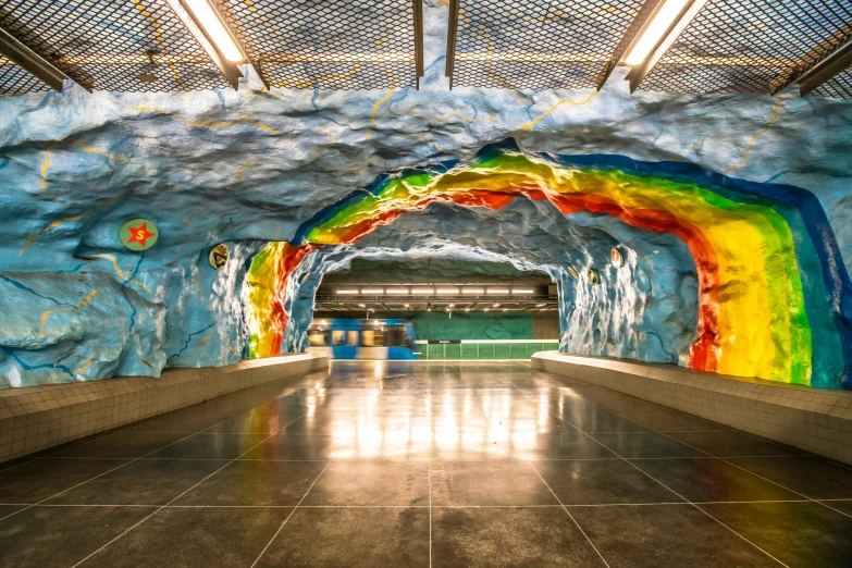 a colorful tunnel that is on the side of the road