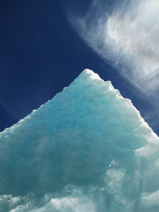 there is a tall ice structure sitting on the snow