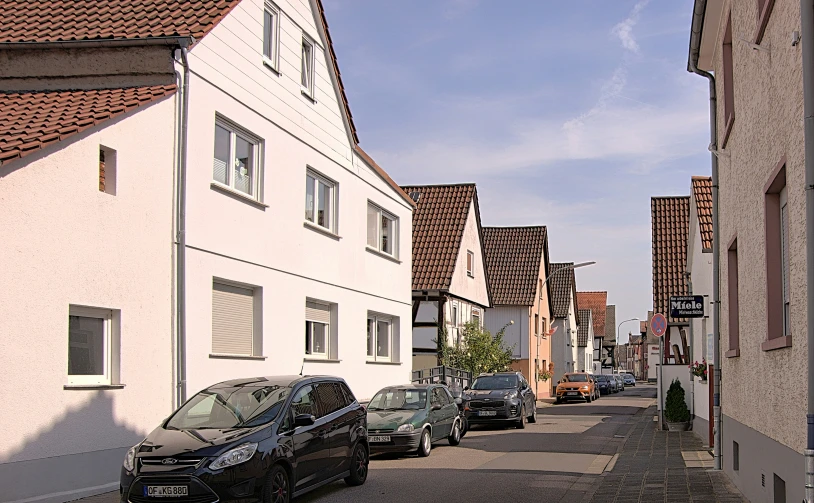 cars are parked on the side of the street