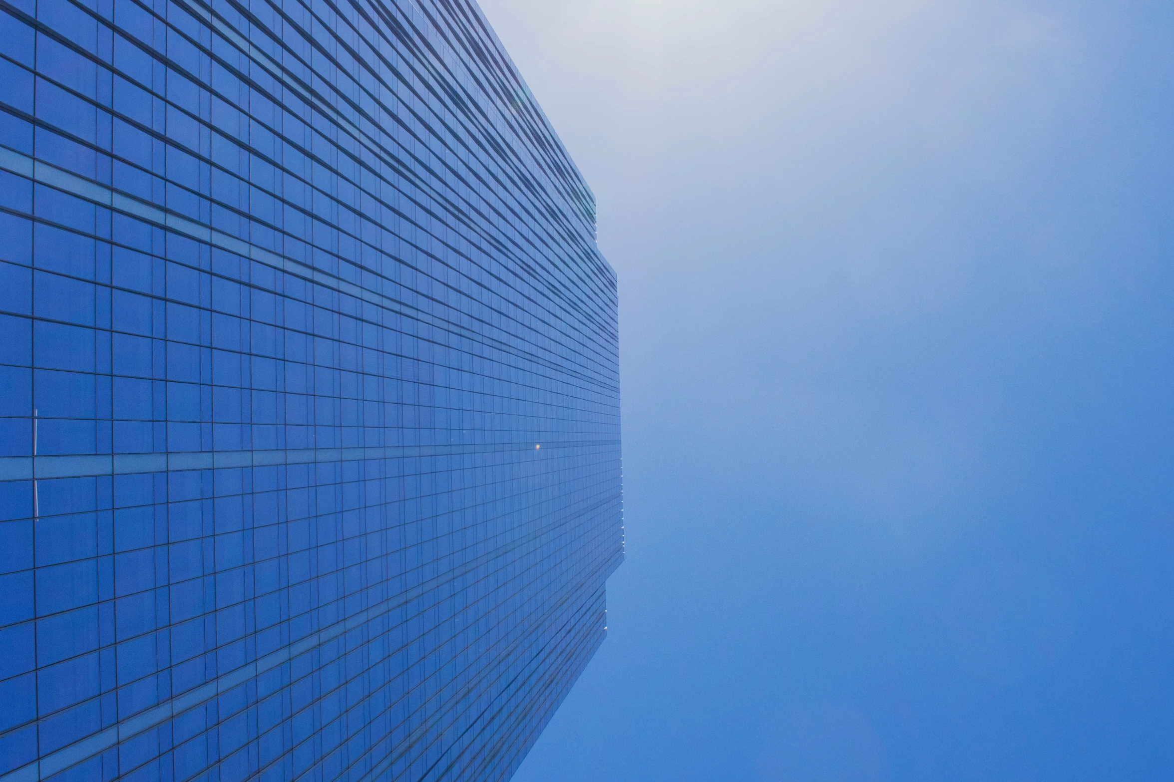 blue skies and a building with a sky in the background