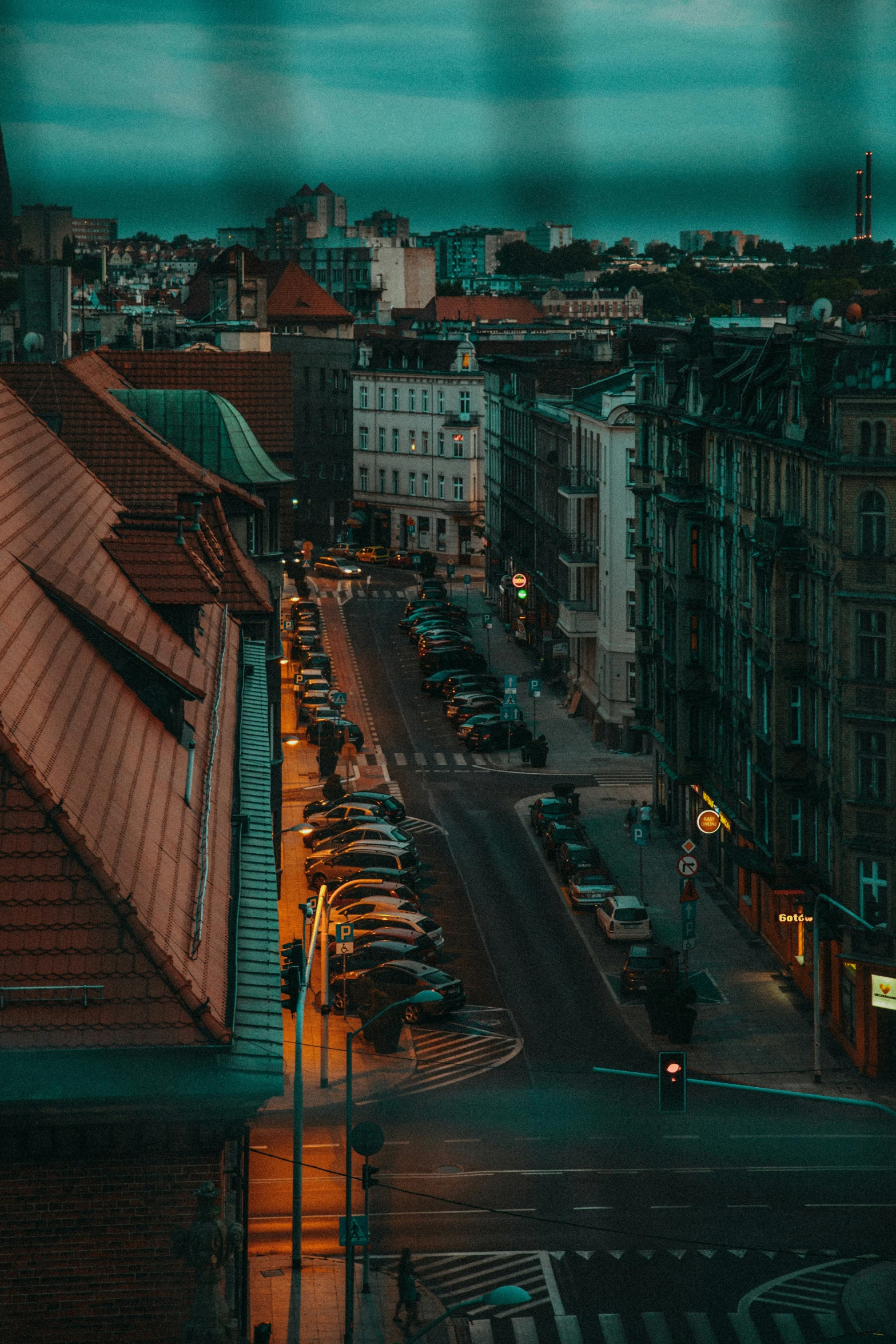 a city is lit up with lights and buildings