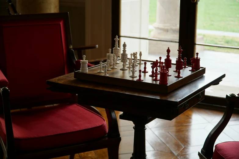 a large chess board with pieces on a chair