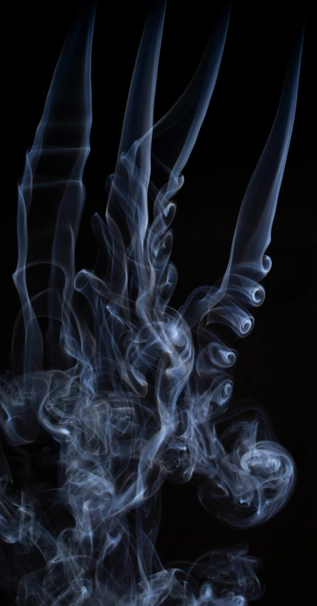 smoke moves around on a black background