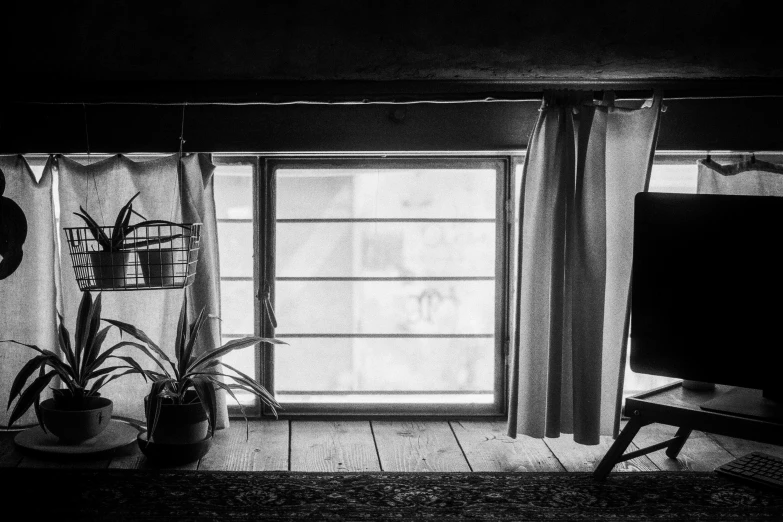 a large window sitting above a tv in a room