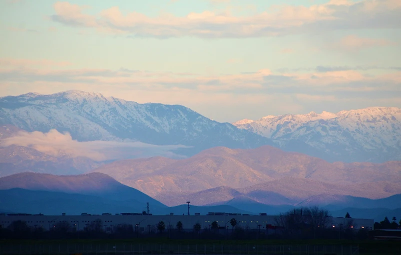 a very beautiful view of mountains and some clouds