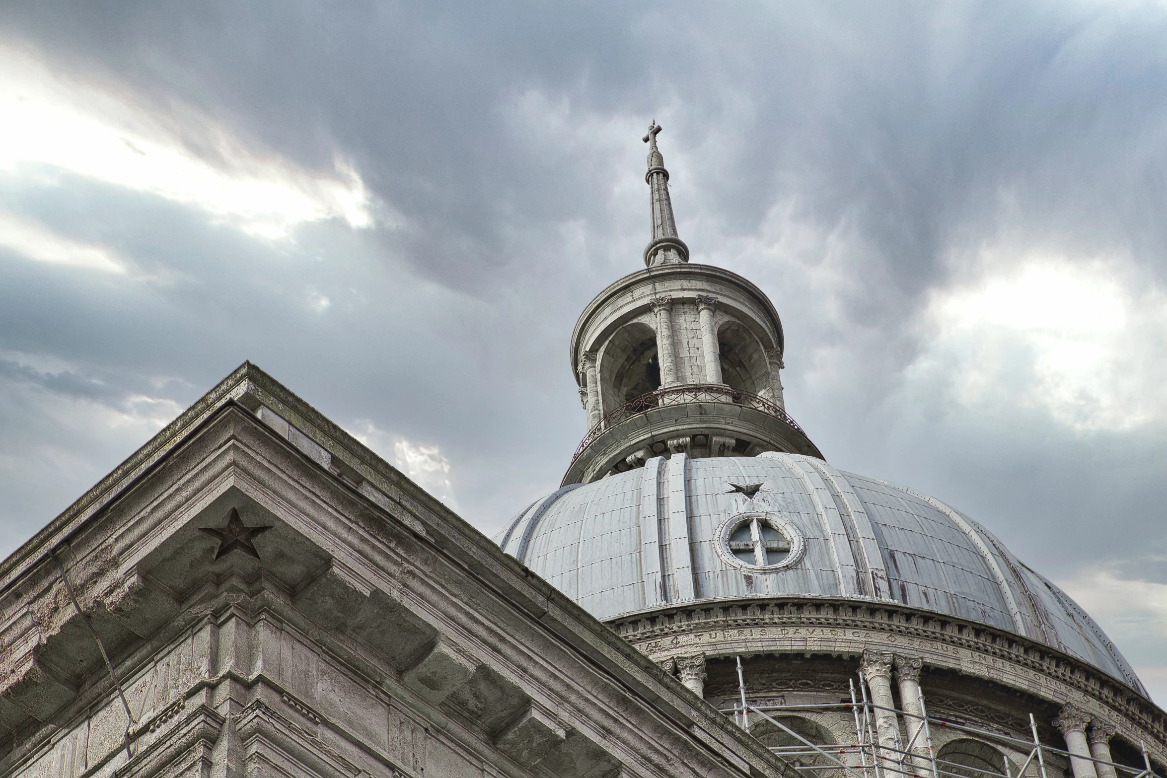 an ornate dome with a steeple and clock is visible