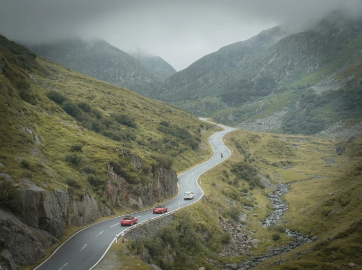 the two cars are driving on the very steep road