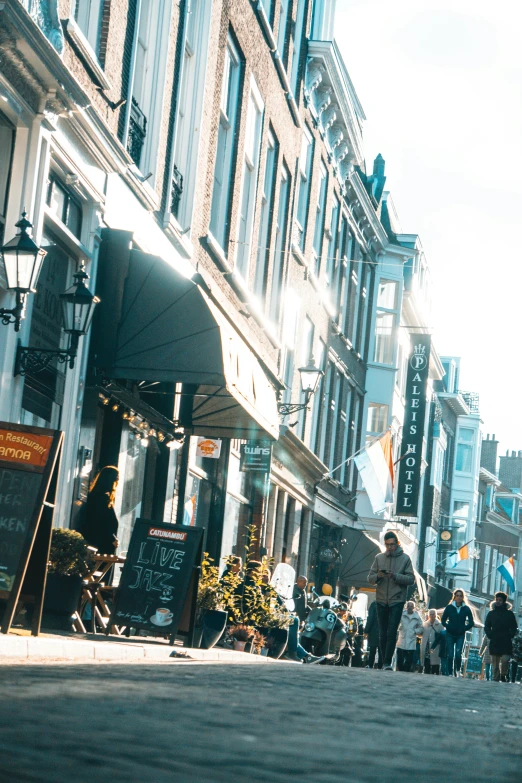 a very big city street with people walking in it