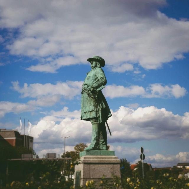 a big statue of a soldier in a city park