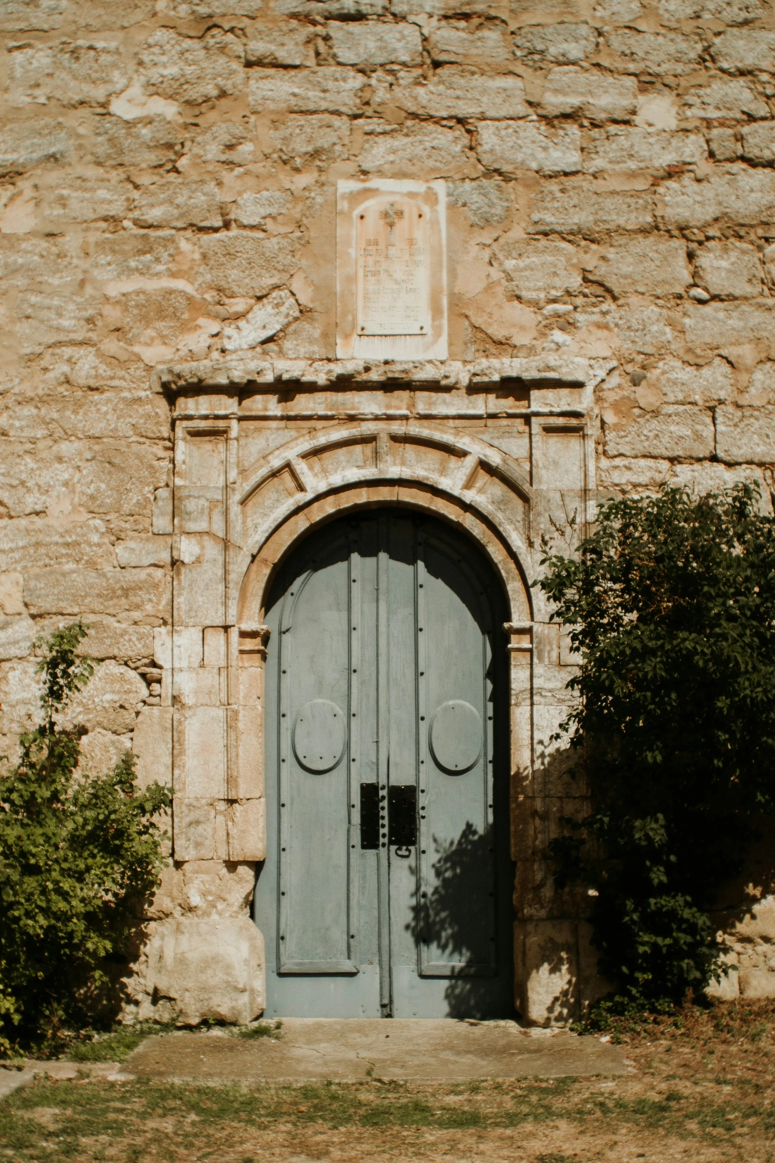 the old entrance to a medieval castle with arched doorways