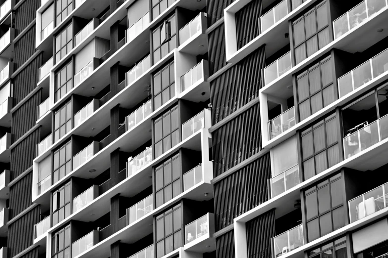 a large building with lots of windows next to a parking meter