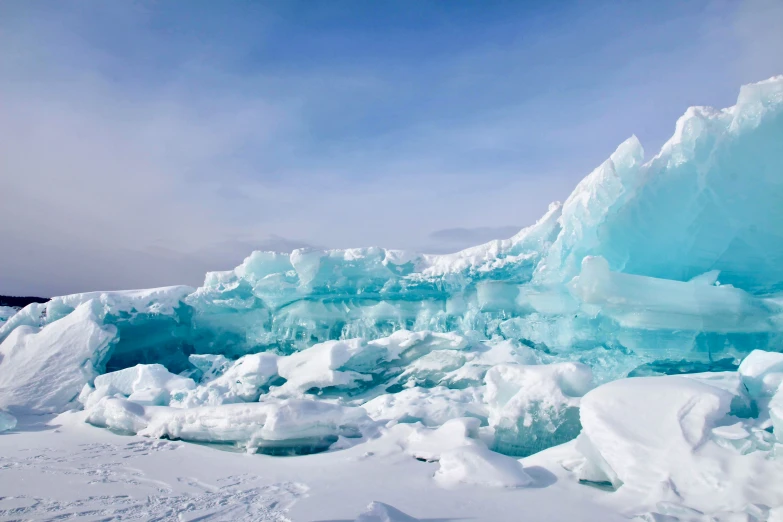 there are some ice chunks that are standing in the snow