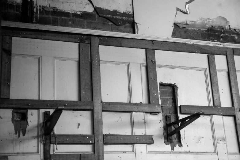 a black and white image of some broken windows