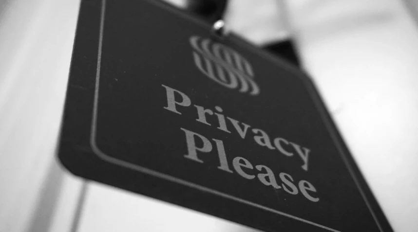 this black and white image is of a privacy please sign