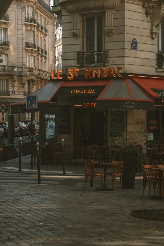 an outside restaurant with wooden tables and chairs