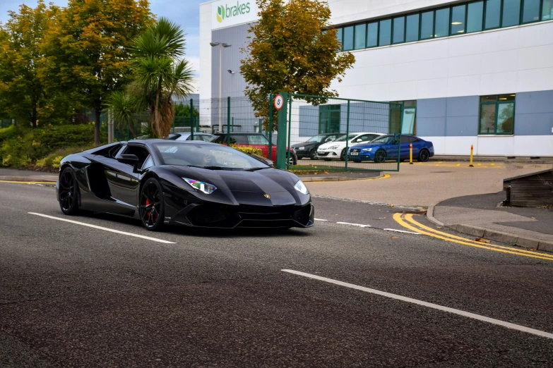 black and green lamb sport car on an urban street