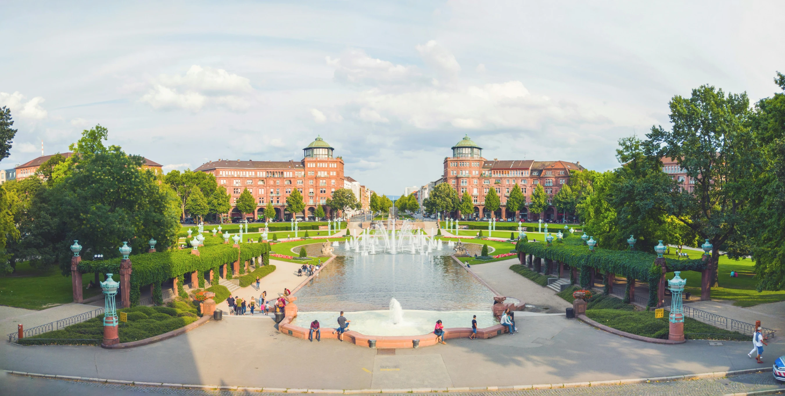 a beautiful view of some pretty gardens and buildings