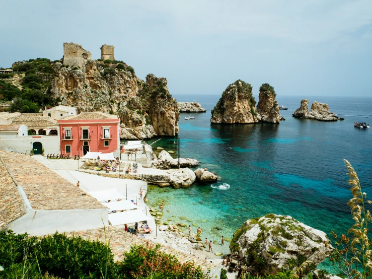 a beautiful view of the ocean and a red building