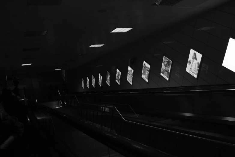 a dark building with a bunch of light streams through it