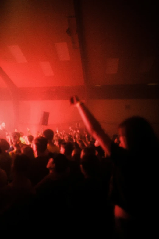 a crowd in a dimly lit room