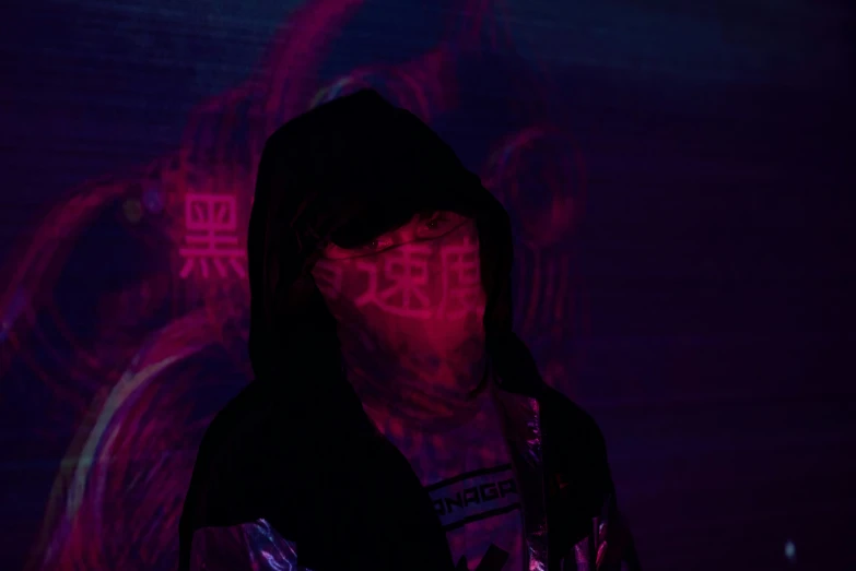 a person in dark clothing standing in front of a dark background