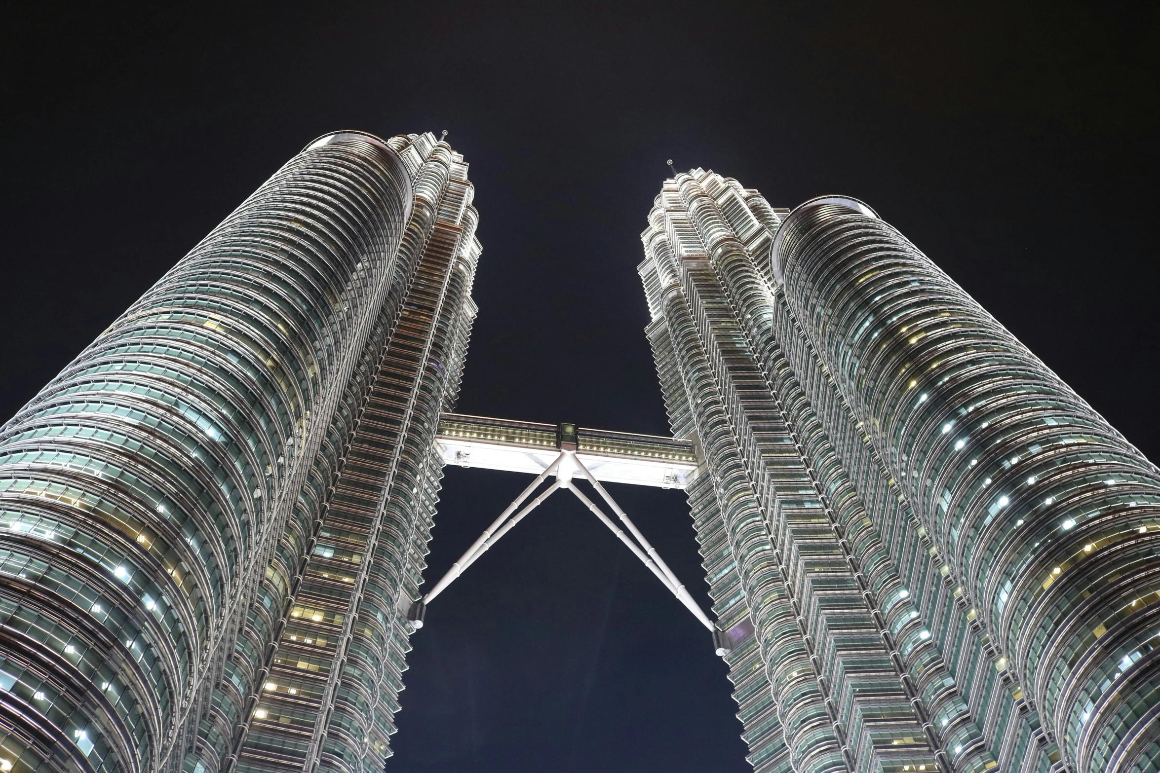 two very tall buildings towering up into the sky