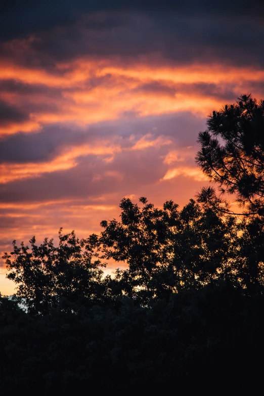 the sky looks red and white as sun sets