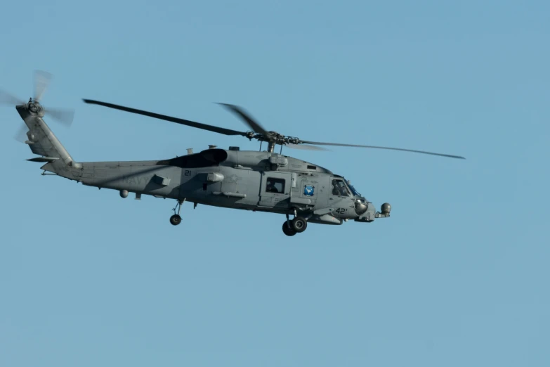 an air force helicopter in flight against the blue sky