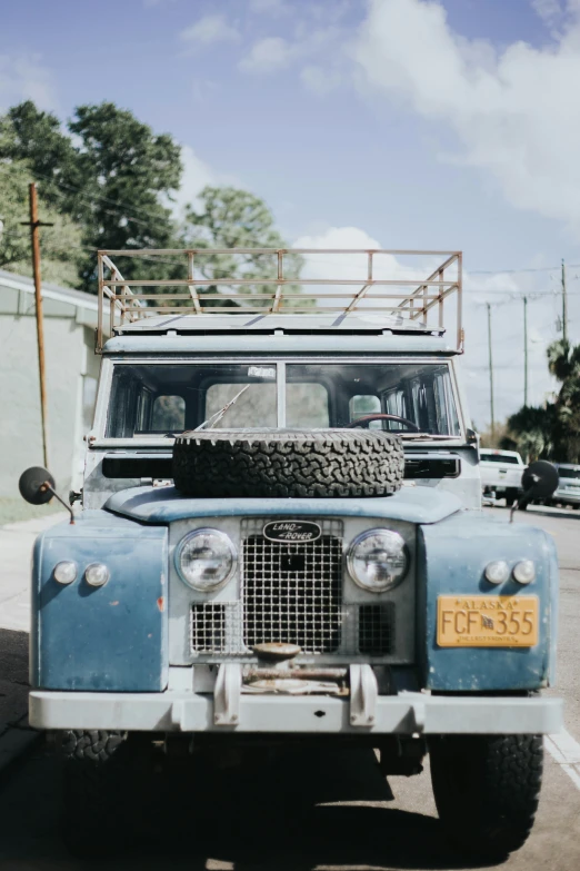 a vehicle with tires and a sky background